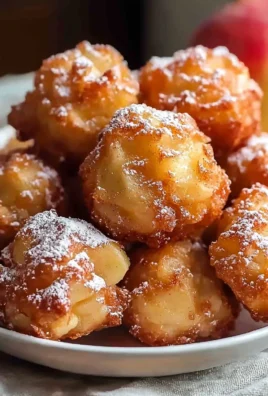 Delicious apple fritter bites with a crispy exterior and soft, fruity filling.