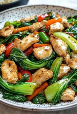 Colorful Chicken Bok Choy Stir Fry with vegetables in a pan.