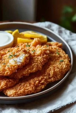 Delicious plate of chicken fried chicken with crispy coating and savory sides