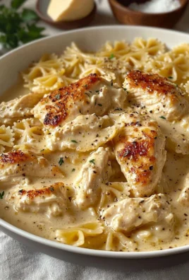 Delicious Chicken Garlic Parmesan Pasta served in a bowl with herbs and cheese