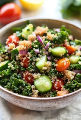 Detox quinoa salad with fresh vegetables and herbs in a bowl
