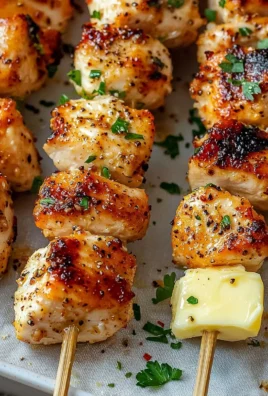 Garlic Parmesan Chicken Skewers grilled to perfection on a platter.