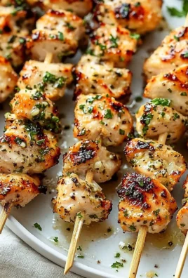 Delicious Garlic-Parmesan Chicken Skewers on a grill platter