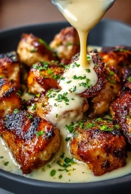 Plate of grilled chicken bites with creamy garlic sauce