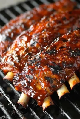 Delicious grilled ribs served with barbecue sauce and sides