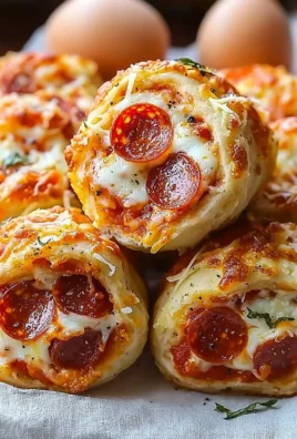 High protein pepperoni pizza rolls on a plate, perfect for snacking.