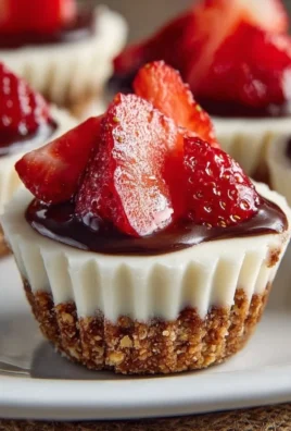 No-bake mini cheesecake cups topped with fresh berries and whipped cream