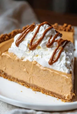 A delicious no bake peanut butter pie topped with whipped cream and chocolate drizzle