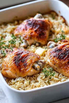 Oven baked chicken served with fluffy rice in a colorful dish