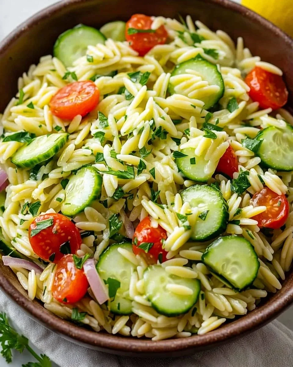 Zesty Cucumber Lemon Orzo Salad served in a bowl with fresh ingredients
