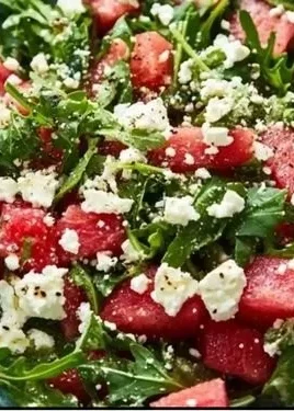 Arugula watermelon feta salad with vibrant colors and fresh ingredients