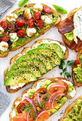 A delicious plate of avocado toast topped with fresh ingredients.
