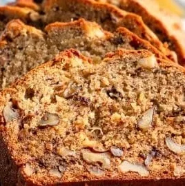 Freshly baked banana nut bread with walnuts and ripe bananas