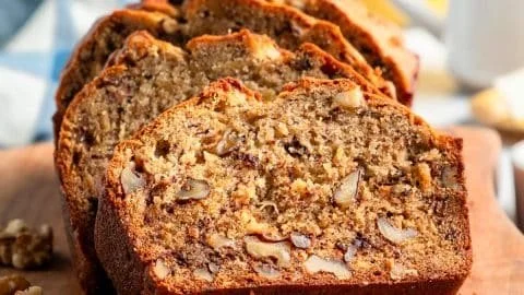 Freshly baked banana nut bread with walnuts and ripe bananas