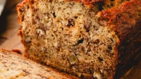 Deliciously baked loaf of best banana bread on a wooden table