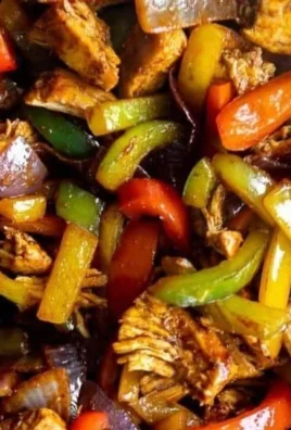 A vibrant Chicken Fajita Bowl filled with grilled chicken, peppers, and rice.