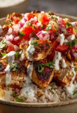 Chicken gyro bowl with fresh vegetables and toppings