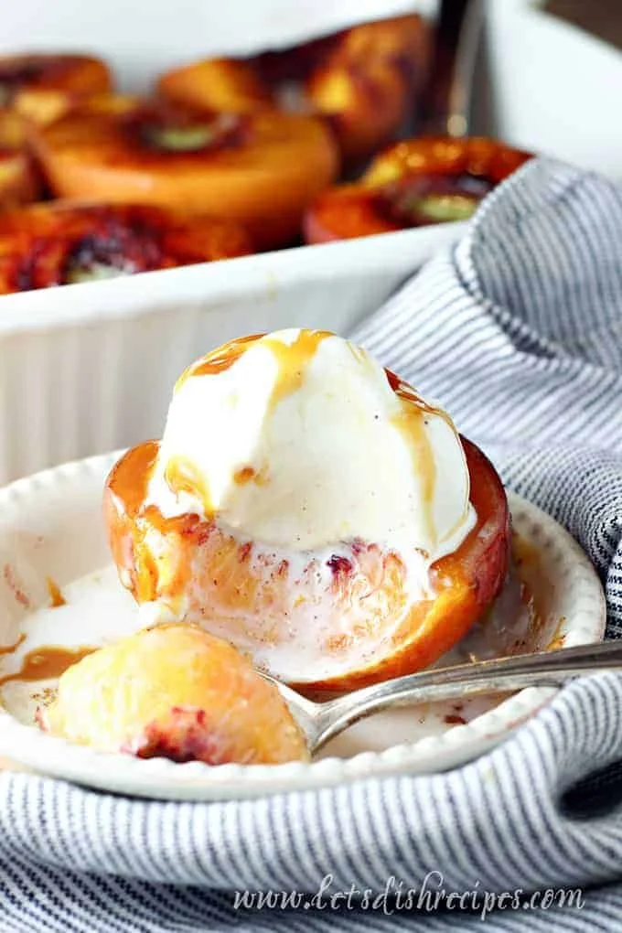 Cinnamon sugar baked peaches topped with a sprinkle of cinnamon