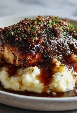 Delicious Garlic Herb Chicken served with herbs and spices on a plate.