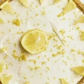 Delicious slice of lemon cheesecake topped with fresh lemon slices