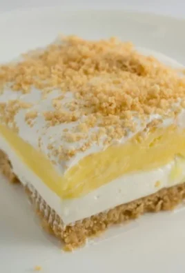Delicious Lemon Oreo dessert topped with whipped cream and lemon slices