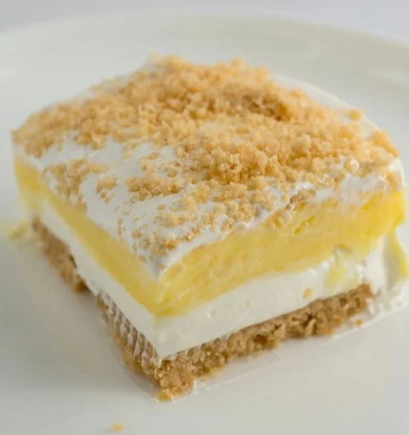 Delicious Lemon Oreo dessert topped with whipped cream and lemon slices