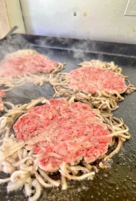 Oklahoma Onion SmashBurger with crispy onions and juicy beef patty