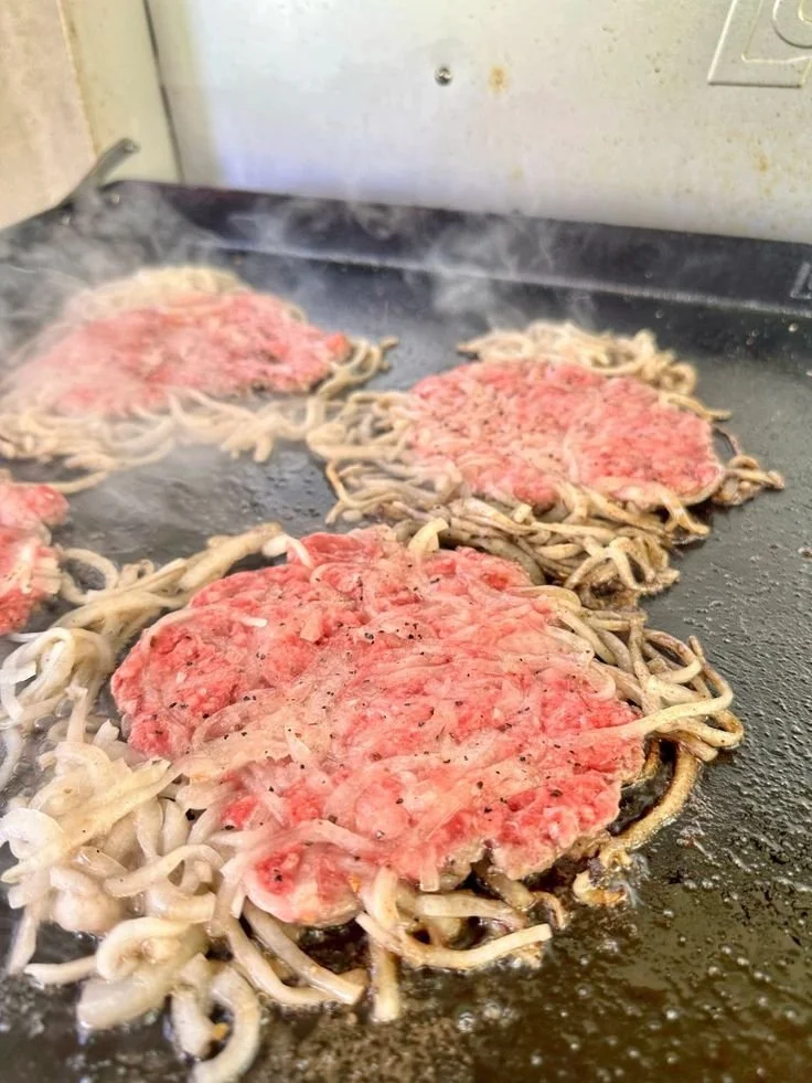 Oklahoma Onion SmashBurger with crispy onions and juicy beef patty