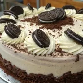 Homemade Oreo Cake with creamy frosting and crushed Oreos on top