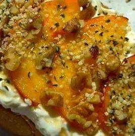 Delicious Peach Toast garnished with fresh slices and honey, perfect for breakfast.