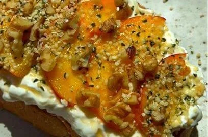 Delicious Peach Toast garnished with fresh slices and honey, perfect for breakfast.