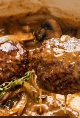 Delicious Southern hamburger steak with gravy served on a plate