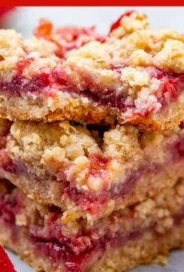 Deliciously baked Strawberry Butter Bars with fresh strawberries on top.