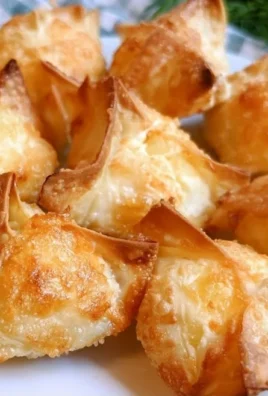 Air fryer pineapple cream cheese wontons with a crispy golden shell
