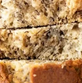 Delicious slice of homemade banana bread on a wooden table