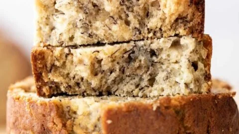 Delicious slice of homemade banana bread on a wooden table