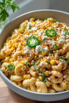 Delicious Mexican street corn pasta salad with fresh ingredients and vibrant colors.