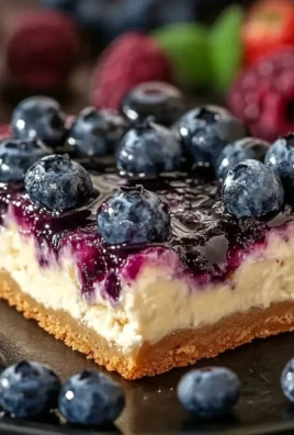 Blueberry cottage cheese breakfast bake served in a dish with fresh blueberries on top.