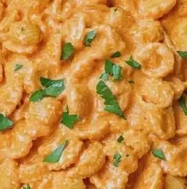 Creamy cottage cheese pasta sauce in a bowl served with pasta.