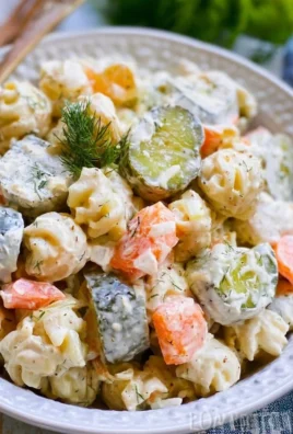 Creamy dill pickle pasta salad featuring pasta, dill pickles, and a tangy dressing.