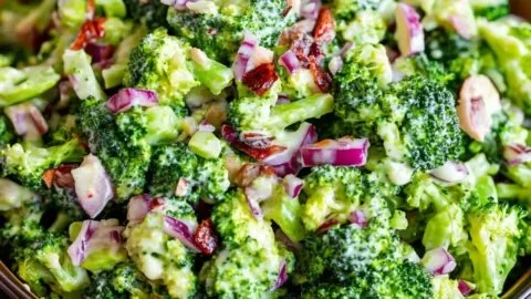 Delicious bowl of easy broccoli salad with fresh vegetables and dressing