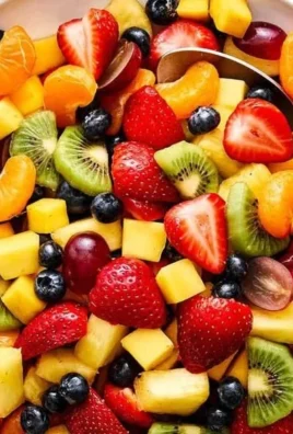 Freshly prepared easy fruit salad with a variety of colorful fruits.