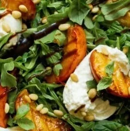 Delicious grilled peach salad with burrata and balsamic drizzle