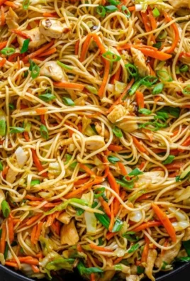 Delicious homemade Chow Mein served with fresh vegetables and noodles