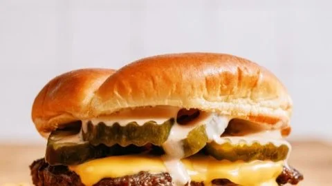 Delicious homemade smash burgers served with Shack sauce on a plate
