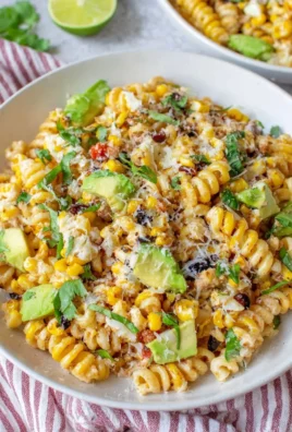 Bowl of Mexican street corn pasta salad with vibrant vegetables and spices
