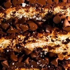 Moist gluten-free banana bread with Greek yogurt and chocolate chips on a wooden table