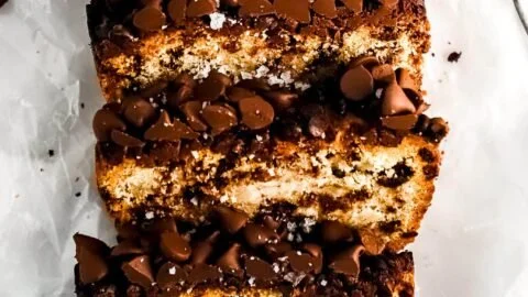 Moist gluten-free banana bread with Greek yogurt and chocolate chips on a wooden table