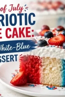 Patriotic Poke Cake with red, white, and blue layers and whipped cream topping