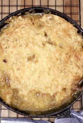 Delicious peach cobbler dump cake served with ice cream
